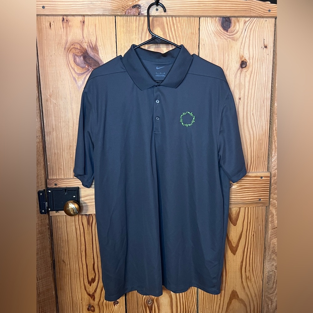 Nike Men's Black Polo Shirt with Green Logo